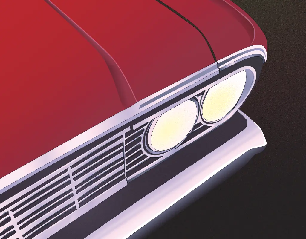the front end of a red classic car from high angle.